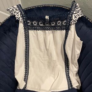 Beautiful tank with navy embroidered detail